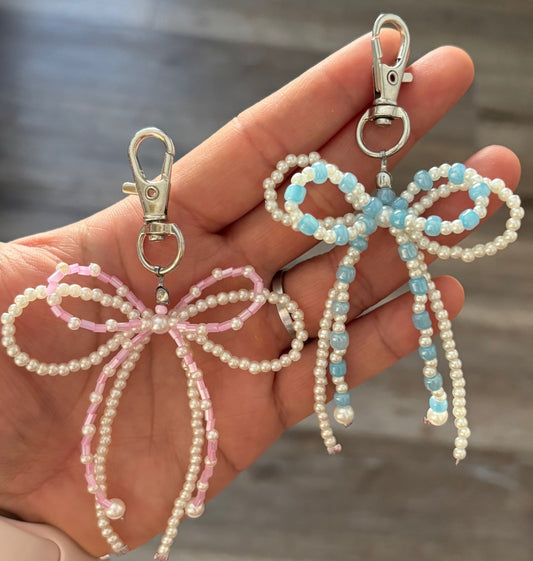 Two Beaded keychains in the shape of a double bow.